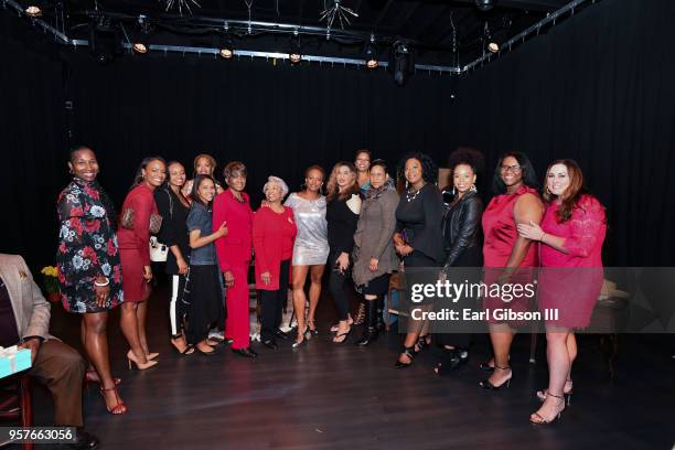 Women representing the Susan B. Komer Foundation pose as Vanessa Bell Calloway is appointed the new face of breast cancer at WACO Theater Center...