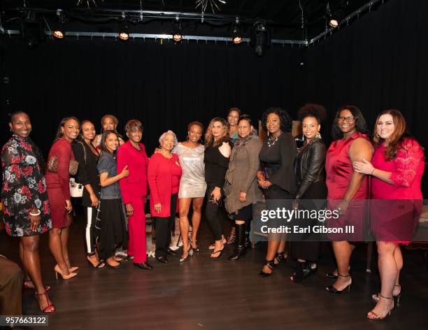 Women representing the Susan B. Komer Foundation pose as Vanessa Bell Calloway is appointed the new face of breast cancer at WACO Theater Center...