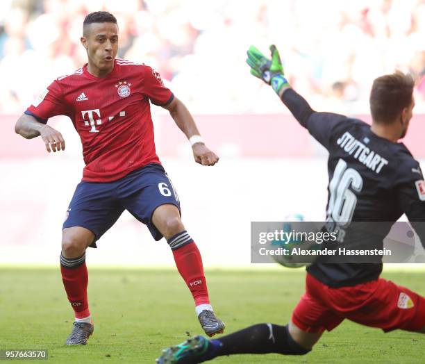 Thiago Alcantara of Bayern Muenchen shoots past Ron-Robert Zieler of Stuttgart during the Bundesliga match between FC Bayern Muenchen and VfB...