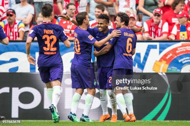 Scorer Theodor Gebre Selassie celebrates his teams second goal with Marco Friedl , Max Kruse and Thomas Delaney during the Bundesliga match between...