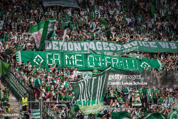 Fans of Bremen show a banner against Hamburger SV during the Bundesliga match between 1. FSV Mainz 05 and SV Werder Bremen at Opel Arena on May 12,...