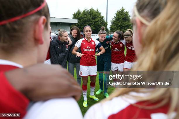 Alex Scott of Arsenal speaks to her teammates in the huddle after her last home game before retirement during the Womens Super League match between...