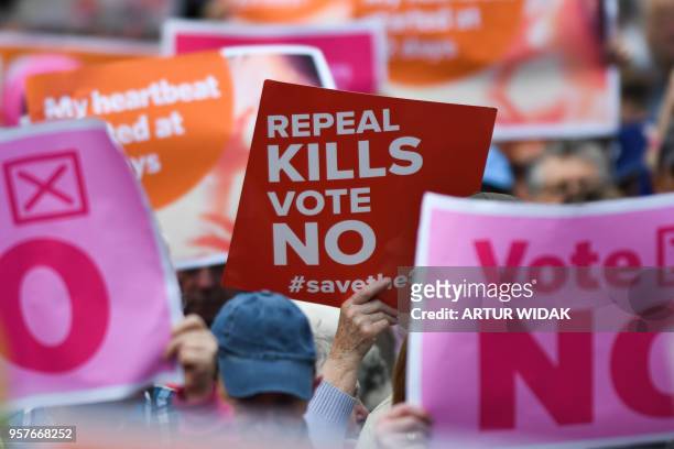 People hold up placards during a "Stand up for Life" rally calling for a 'no' vote in the upcoming referendum, to preserve the eighth amendment of...
