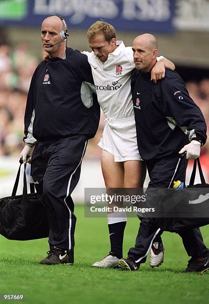 Stand-in England Captain Matt Dawson leaves the field injured during the 2001 Six Nations Championship match between Ireland and England played at...