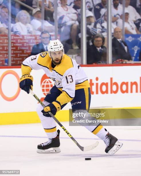 Nick Bonino of the Nashville Predators plays the puck down the ice during third period action against the Winnipeg Jets in Game Six of the Western...