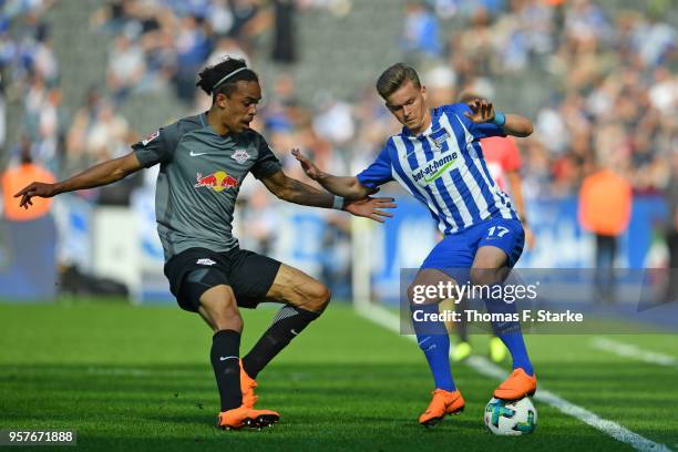 Yussuf Poulsen of Leipzig and Maximilian Mittelstaedt of Berlin fight for the ball during the Bundesliga match between Hertha BSC and RB Leipzig at...