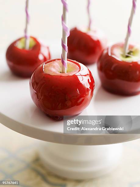 mini candies apples with decorated sticks - taffy apple stock pictures, royalty-free photos & images