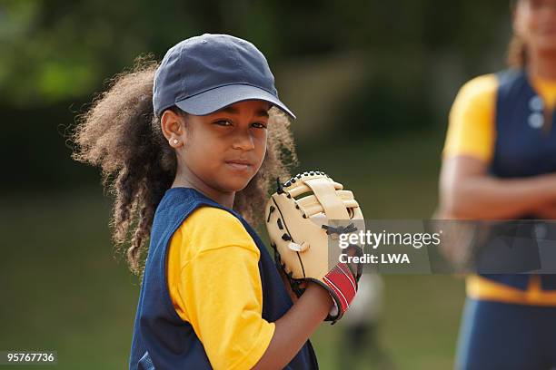 little leaguer practicing pitching - girl baseball cap stock pictures, royalty-free photos & images