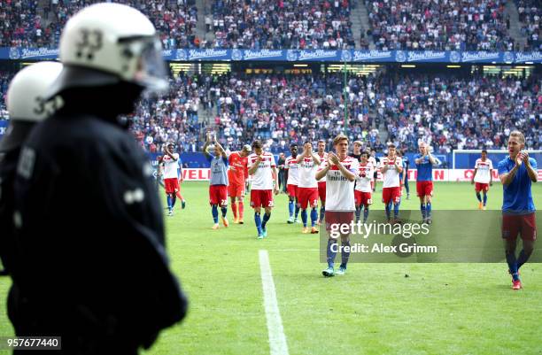 Hamburger SV players applaud the fans after their relegation after the Bundesliga match between Hamburger SV and Borussia Moenchengladbach at...