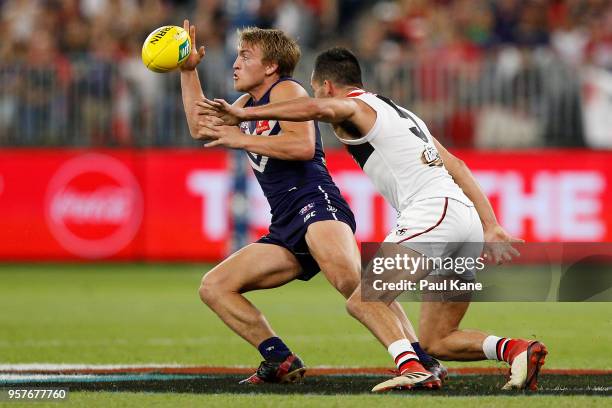 Mitchell Crowden of the Dockers contests for the ball against Shane Savage of the Saints during the round eight AFL match between the Fremantle...