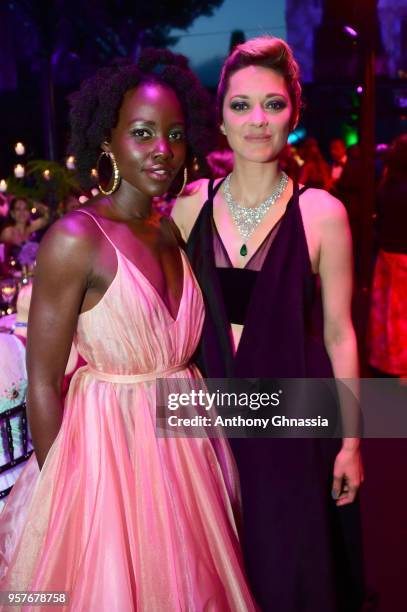 Lupita Nyong'o and Marion Cotillard attend Chopard Secret Night during the 71st annual Cannes Film Festival at Chateau de la Croix des Gardes on May...