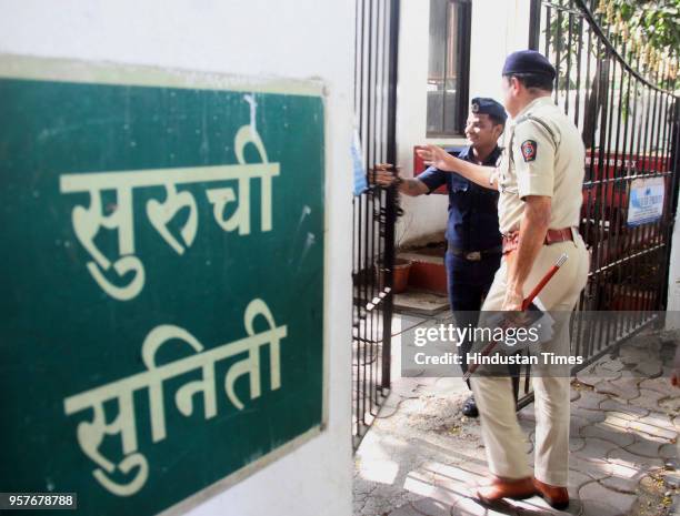 Police personnel outside Suruchi Suniti Building after Himanshu Roy committed suicide at his home, on May 11, 2018 in Mumbai, India. The 55-year-old...