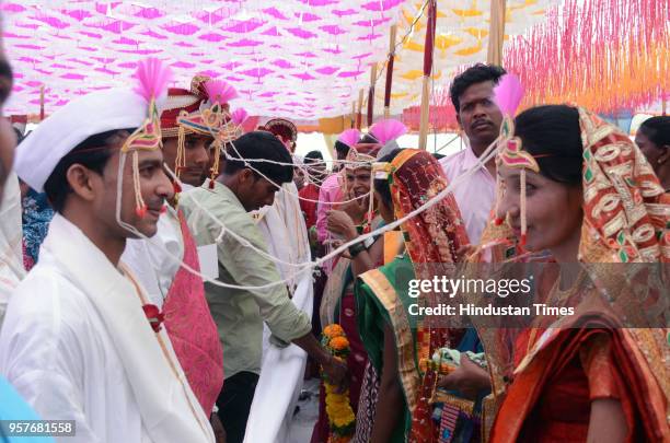 Couples get married in a mass wedding ceremony organized by Thane Shubmangal Samity Dharmadayi Santha and Ajikya Prathisthan at Bhartiya Sainik...