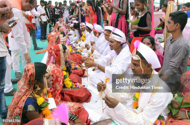 Couples get married in a mass wedding ceremony organized by Thane Shubmangal Samity Dharmadayi Santha and Ajikya Prathisthan at Bhartiya Sainik...