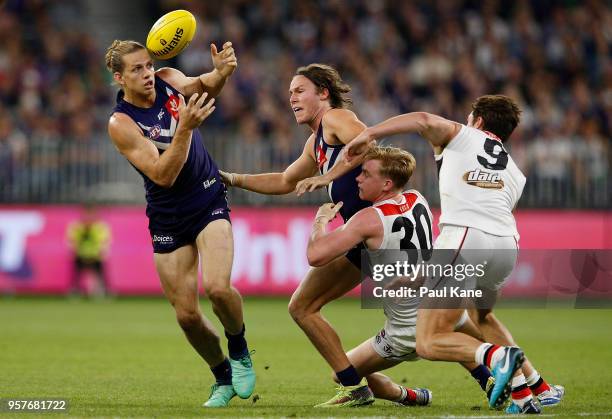 Nathan Fyfe of the Dockers gathers the ball during the round eight AFL match between the Fremantle Dockers and the St Kilda Saints at Optus Stadium...