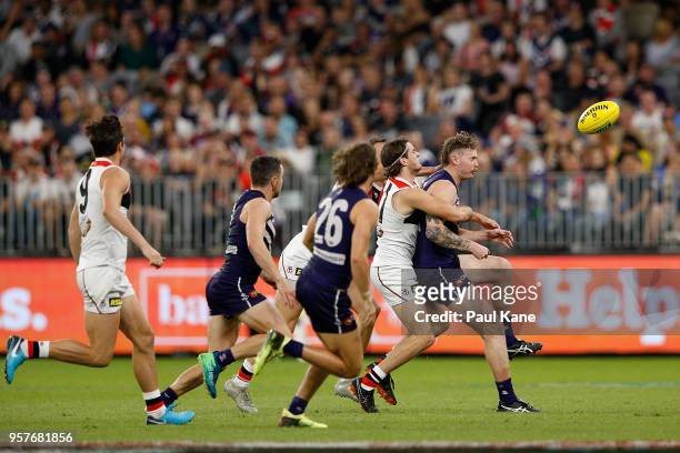 Cam McCarthy of the Dockers gets tackled by Hunter Clark of the Saints during the round eight AFL match between the Fremantle Dockers and the St...