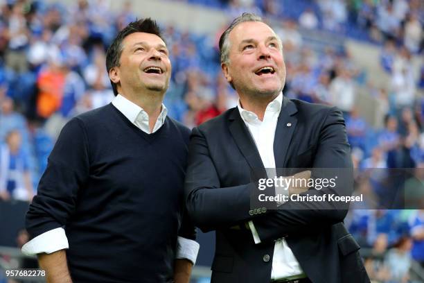 Manager Christian hooded and Clemens Toennies, chairman of the board smile after winning 1-0 the Bundesliga match between FC Schalke 04 and Eintracht...