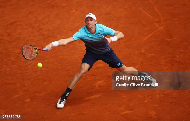 Kevin Anderson of South Africa plays a forehand against Dominic Thiem of Austria in their semi final during day eight of the Mutua Madrid Open tennis...