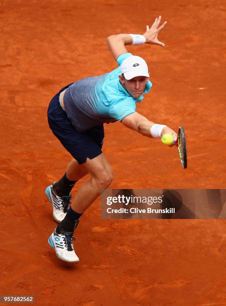 Kevin Anderson of South Africa plays a backhand against Dominic Thiem of Austria in their semi final during day eight of the Mutua Madrid Open tennis...