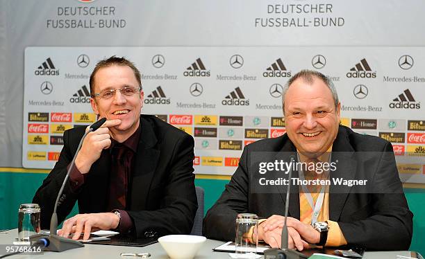 Harald Stenger , head of communication of German football association and organizer and scientist Tim Meyer smile at the press conference during the...