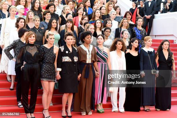 Filmmakers on the steps of the red carpet in protest of the lack of female filmmakers honored throughout the history of the festival at the screening...