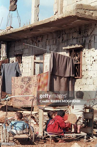 Palestinian children play in the yard of a house in the refugee camp of Shatila, near Beirut, 20 january 1988, where life went back to normal, after...