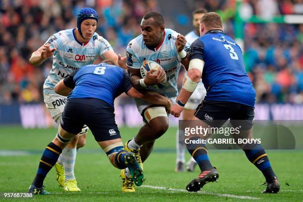 Racing 92's Fijian flanker Leone Nakarawa tries to escape a tackle during the 2018 European Champions Cup final rugby union match between Racing 92...