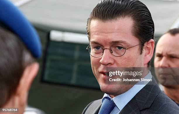 German Defense Minister Karl-Theodor zu Guttenberg arrives for a first visit of the Bundeswehr medical regiment on January 14, 2010 in Feldkirchen,...