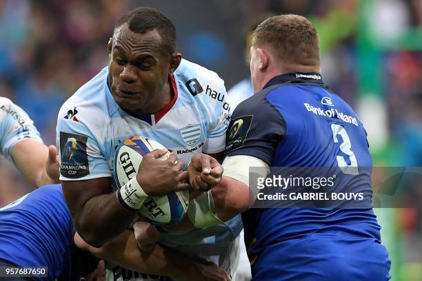 Racing 92's Fijian flanker Leone Nakarawa tries to escape a tackle by Leinster's Irish prop Tadhg Furlong during the 2018 European Champions Cup...