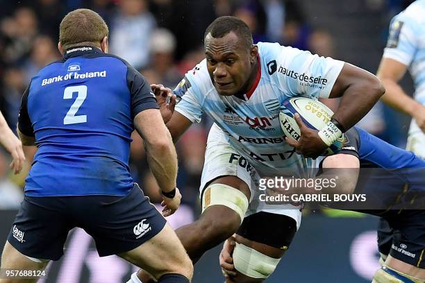 Racing 92's Fijian flanker Leone Nakarawa tries to escape a tackle by Leinster's Irish hooker Sean Cronin during the 2018 European Champions Cup...