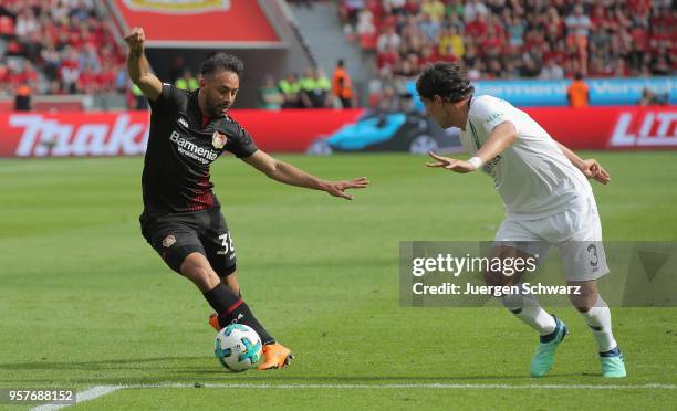 Karim Bellarabi of Leverkusen and Miiko Albornoz of Hannover compete during the Bundesliga match between Bayer 04 Leverkusen and Hannover 96 at...