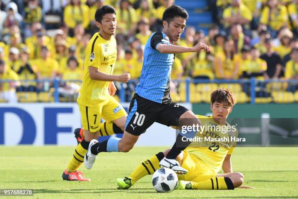 Ryota oshima of Kawasaki Frontale and Park Jeongsu of Kashiwa Reysol compete for the ball during the J.League J1 match between Kashiwa Reysol and...