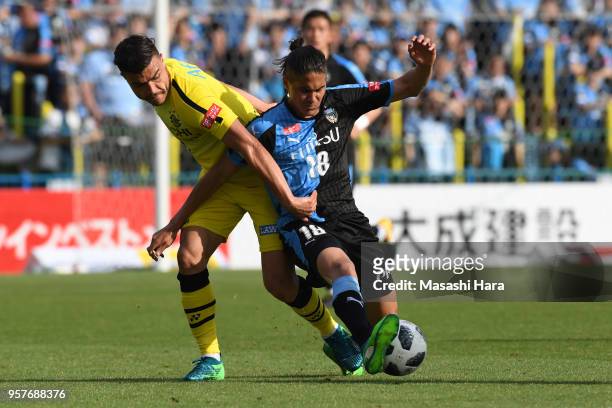 Elsinho of Kawasaki Frontale and Cristiano of Kashiwa Reysol compete for the ball during the J.League J1 match between Kashiwa Reysol and Kawasaki...