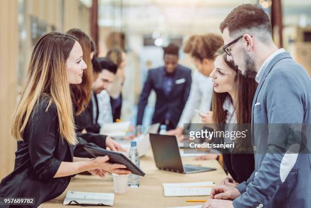 business people having a meeting - exhibition stock pictures, royalty-free photos & images