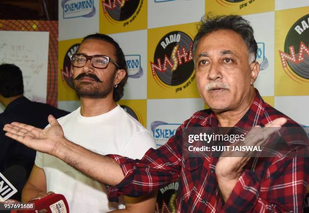 Indian Bollywood actor Aamir Khan and director Mansoor Khan attend the 30th anniversary event for his debut Hindi film 'Qayamat Se Qayamat Tak' in...