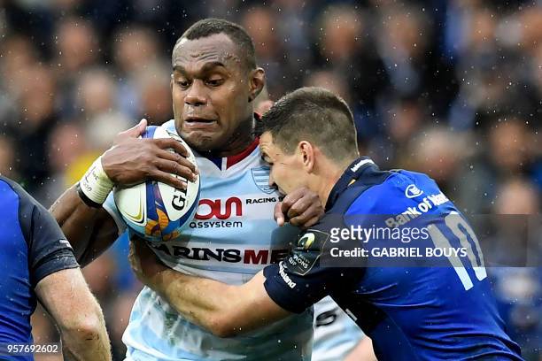 Racing 92's Fijian flanker Leone Nakarawa challenges Leinster's Irish fly-half Johnny Sexton during the 2018 European Champions Cup final rugby union...