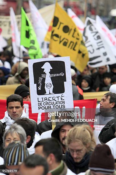 People protest during a demonstration called by association "Ministere de la Regularisation globale de tous les sans papiers" for the regularizing of...