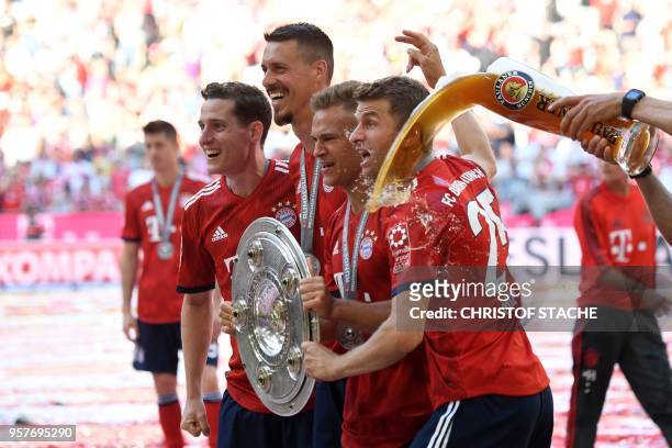 Bayern Munich's German midfielder Sebastian Rudy, forward Sandro Wagner, German midfielder Joshua Kimmich and German forward Thomas Mueller are...