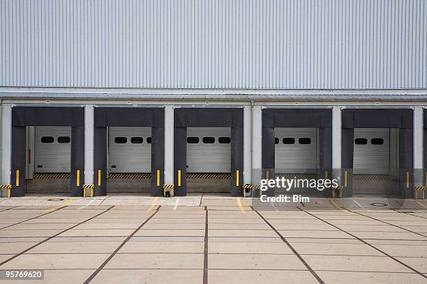 warehouse loading bays - loading dock ramps stock pictures, royalty-free photos & images