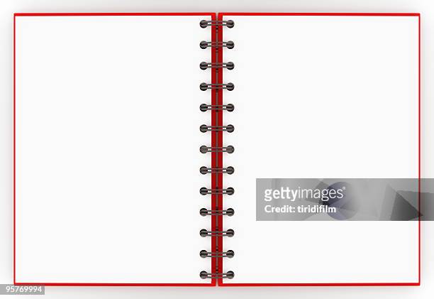 a red spiral notebook opened up to a blank non-lined pages - spiraalblok stockfoto's en -beelden
