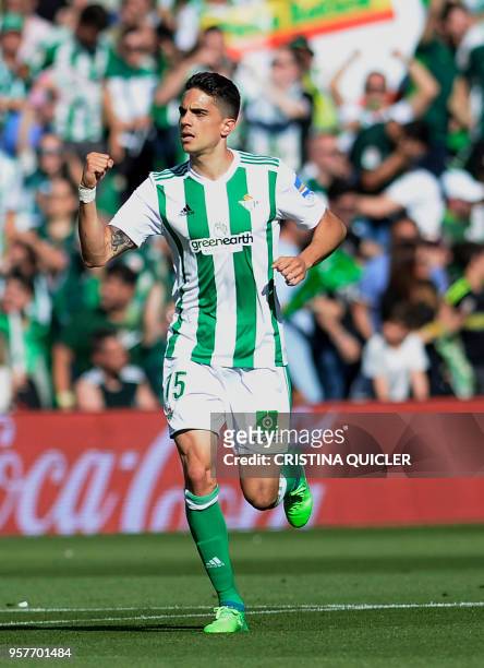 Real Betis' Spanish defender Marc Bartra celebrates after scoring a goal during the Spanish league football match between Real Betis and Sevilla at...