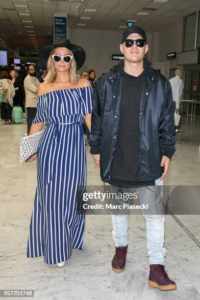 Paris Hilton and Chris Zylka are seen during the 71st annual Cannes Film Festival at Nice Airport on May 12, 2018 in Nice, France.