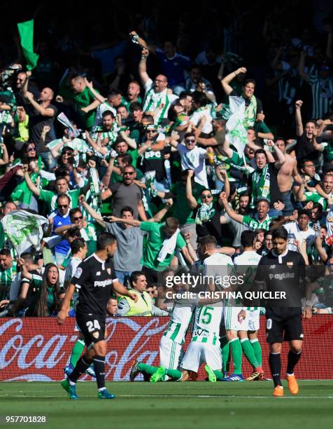 Real Betis' Spanish defender Marc Bartra celebrates after scoring a goal during the Spanish league football match between Real Betis and Sevilla at...