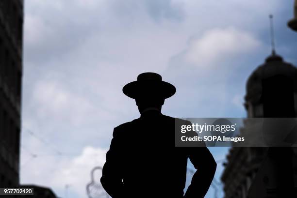 Silhouette of a horse rider seen in a Granada street during the procession of El Rocio. The Romeria del Rocio is one of the most popular festivities...