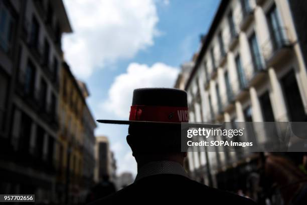 Man wearing typical Spanish hat seen in Reyes Catolicos street in Granada during the procession of El Rocio.The Romeria del Rocio is one of the most...