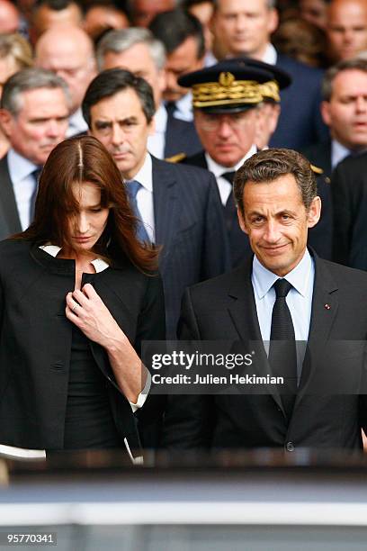 First Lady Carla Bruni-Sarkozy, French President Nicolas Sarkozy and French Prime Minister Francois Fillon leave the Notre Dame Cathedral after a...