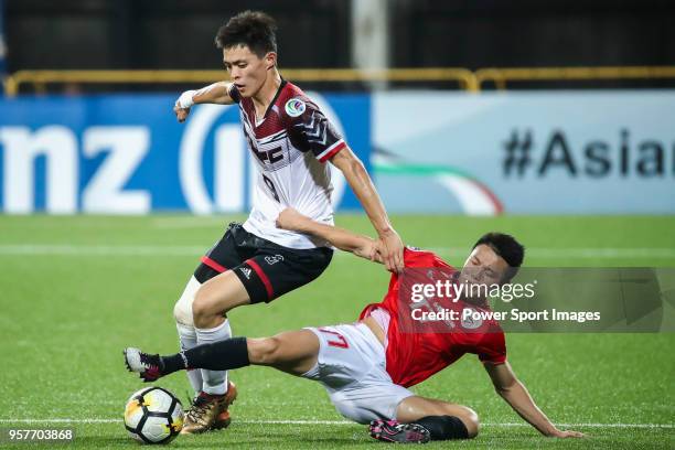 Chen Ching-Hsuan of Hang Yuen FC fights for the ball with Chan Man of Benfica Macau during the AFC Cup 2018 Group I match between Hang Yuen FC and...