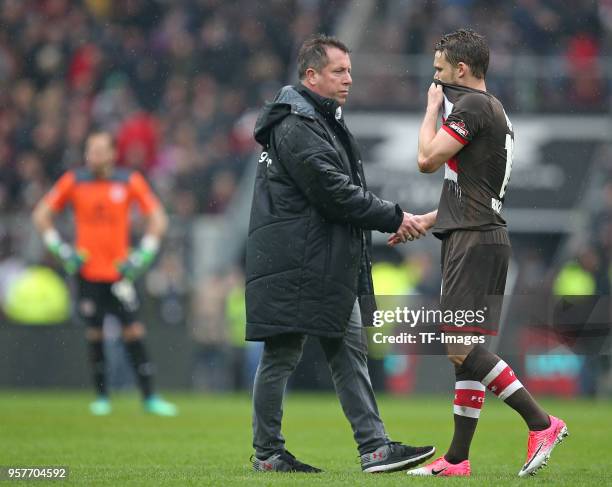 Head coach Markus Kauczinski of St. Pauli and Christopher Buchtmann of St. Pauli look dejected after the Second Bundesliga match between FC St. Pauli...