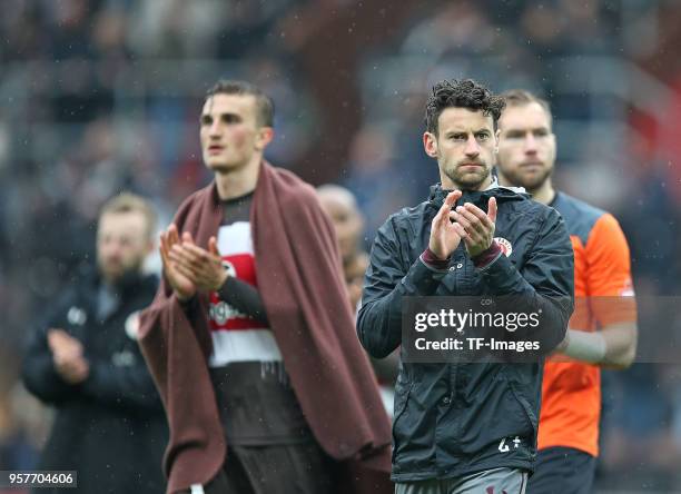 Philipp Ziereis of St. Pauli, Jan-Philipp Kalla of St. Pauli and Goalkeeper Robin Himmelmann of St. Pauli look dejected after the Second Bundesliga...