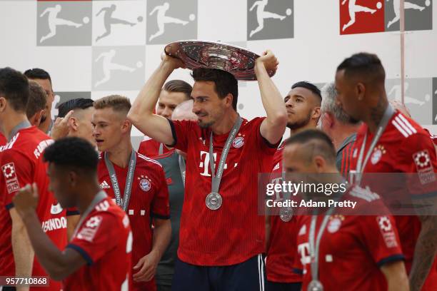 Mats Hummels of Bayern Muenchen holds the champions trophy after the Bundesliga match between FC Bayern Muenchen and VfB Stuttgart at Allianz Arena...